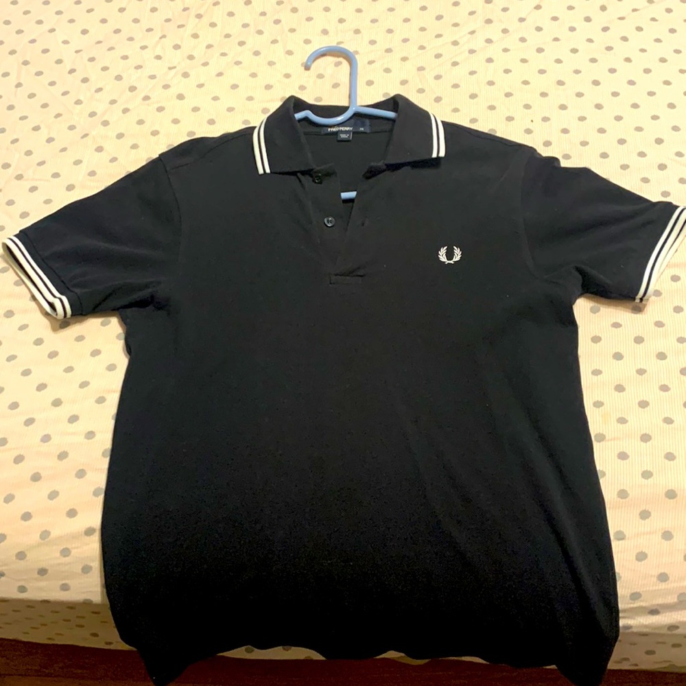 Fred Perry XS polo. Still a ton of use out of this garment. I sized up.